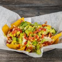 High Tide Nachos · Served with chips, queso, pico, mashed pino beans, chipotle sour cream salsa rioja and toppe...