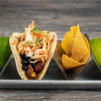 Sweet Plantain Taco · Sweet Plantains, black beans, marinated cabbage and carrots and cilantro.