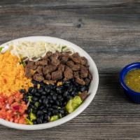 Steak Bowl · Marinated steak with pico, queso blanco, salsa verde and lettuce.