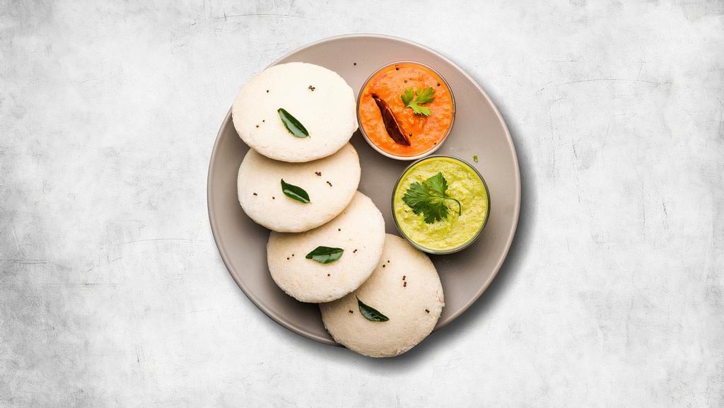 The Incredible Idli (4) · Steamed savory rice cakes served with a lentil soup, a tangy tomato and classic coconut relish