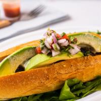 The Mexican Dog · Spicy chipotle sausage topped with avocado and pico de gallo.