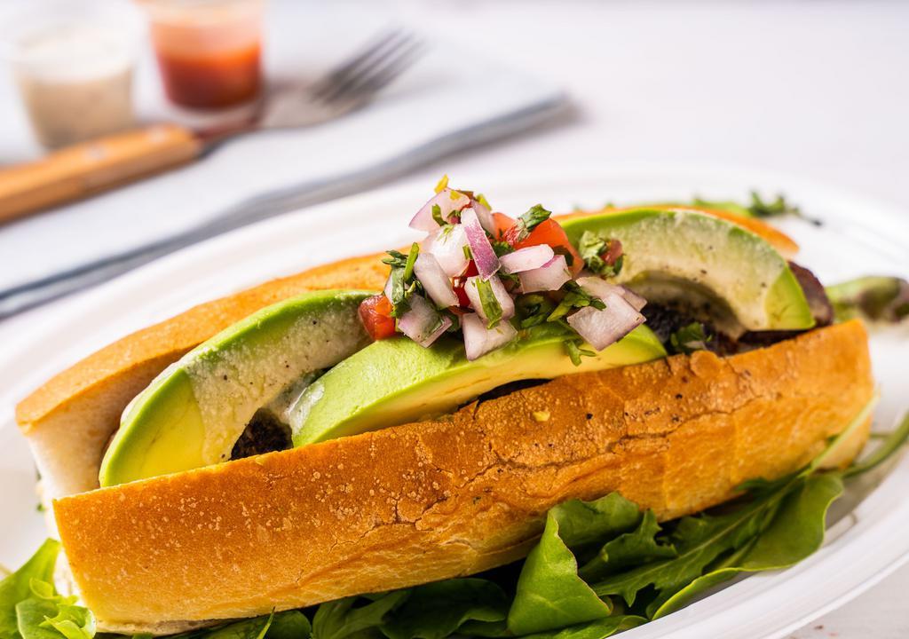 The Mexican Dog · Spicy chipotle sausage topped with avocado and pico de gallo.