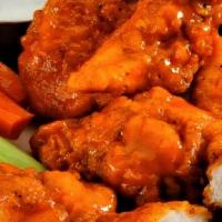Boneless Wings Combo · 6 pieces. Served with Waffle or Sweet Potato fries, Celery, Carrots, Blue Cheese and Can soda.