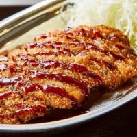 Pork Katsu Curry · Panko-breaded fried pork cutlet, drizzled with tonkatsu sauce, served with shredded cabbage ...