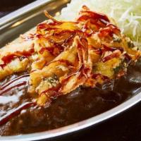 Veggie Tempura Curry · 2 Tempura-fried veggie patties, drizzled with tonkatsu sauce, served with shredded cabbage a...
