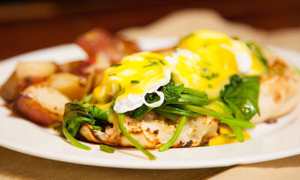 Organic Eggs Florentine · Made with an English muffin, steamed spinach, two organic poached eggs, our homemade hollandaise sauce and a side. Served with Potatoes. Includes coffee or tea.