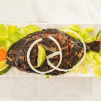 Tandoori Pomfret · Pomfret fish marinated with spices and cooked in clay oven.