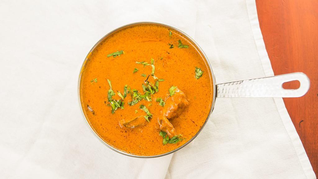 Chicken Bijli · Tandoor marinated boneless chicken cooked in special sauce, garnished with cashews.