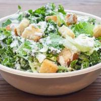 Kale And Romaine Caesar Salad · Garlic croutons and creamy caesar dressing.