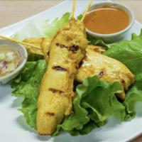 A-3. Satay Chicken (4 Skewers) · Grilled chicken skewers served with peanut sauce and cucumber relish.