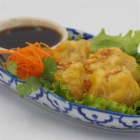 A-4. Steamed Dumpling · Steamed chicken and shrimp dumpling with soy dipping sauce.