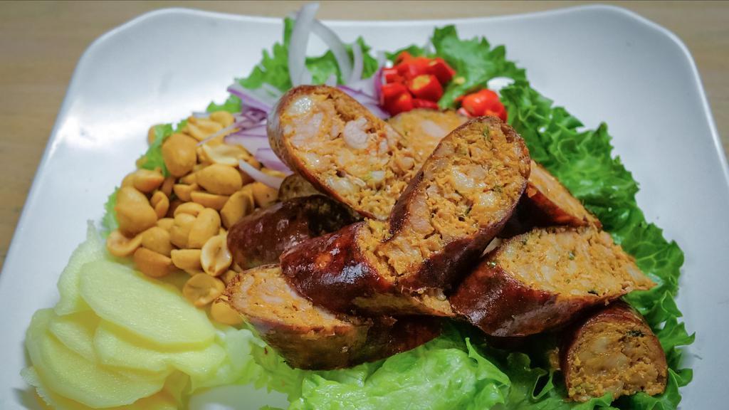 A-12. Northern Thai Sausage · Northern Thai style pork sausage seasoned with Thai herbs served with ginger, chili, red onion, and peanuts on the side.