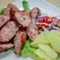A-11. E-Sarn Sausage · North-Eastern Thai style sour pork sausage served with ginger, chili, red onion, and peanuts...