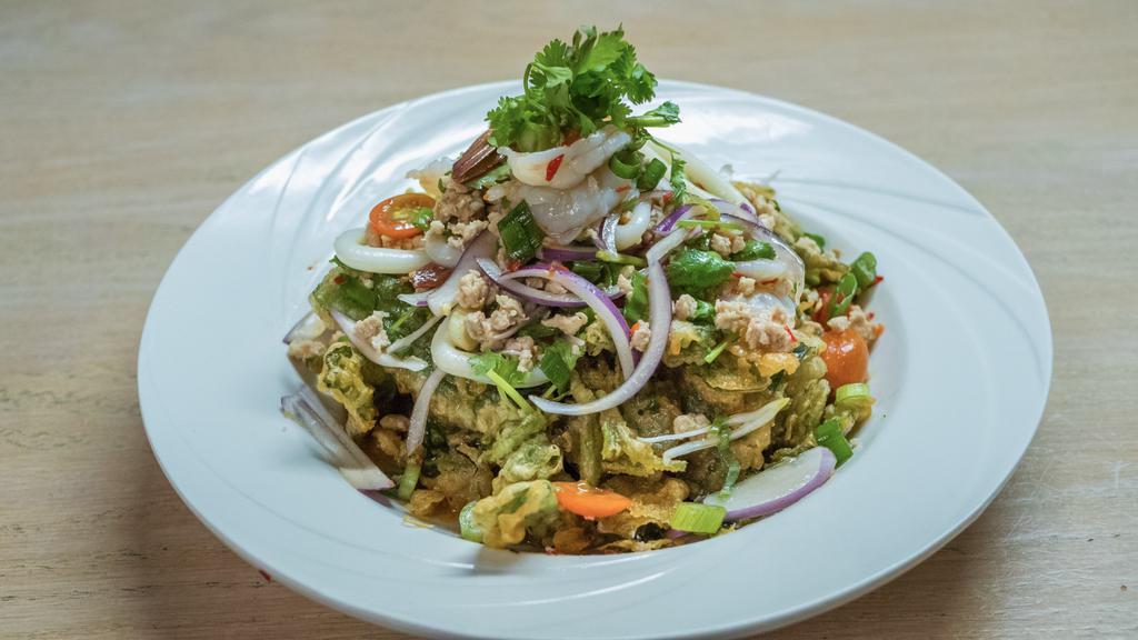 Y-15. Crispy Chinese Watercress Salad · Battered-fry watercress, tossed with shrimp, squid, ground chicken, cashew nuts, scallion, red onion, cilantro, seasoned with chili, lime juice, fish sauce, and sugar.