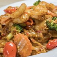 Drunken Noodle · Sautéed broad noodles with choice of protein*, spicy basil sauce, mixed vegetable, and egg.