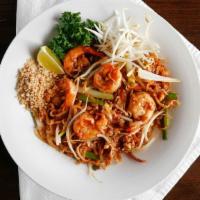 L- Pad Thai · Thai style stir fried rice flat noodle with veggies, egg, and crushed peanut. Served with so...