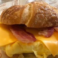 Croissant Classic Sandwich · Scrambled egg, American cheese, and choice of meat.