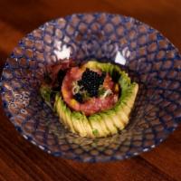 Toro Tartare · Finely chopped fatty tuna, pickled daikon radish scallion, sliced avocado and served with wa...