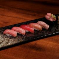 Bluefin Tuna Flight · 1 piece of Akami, Chu Toro, O Toro, Seared Chu Toro, Zuke Tuna, and O Toro Gunkan