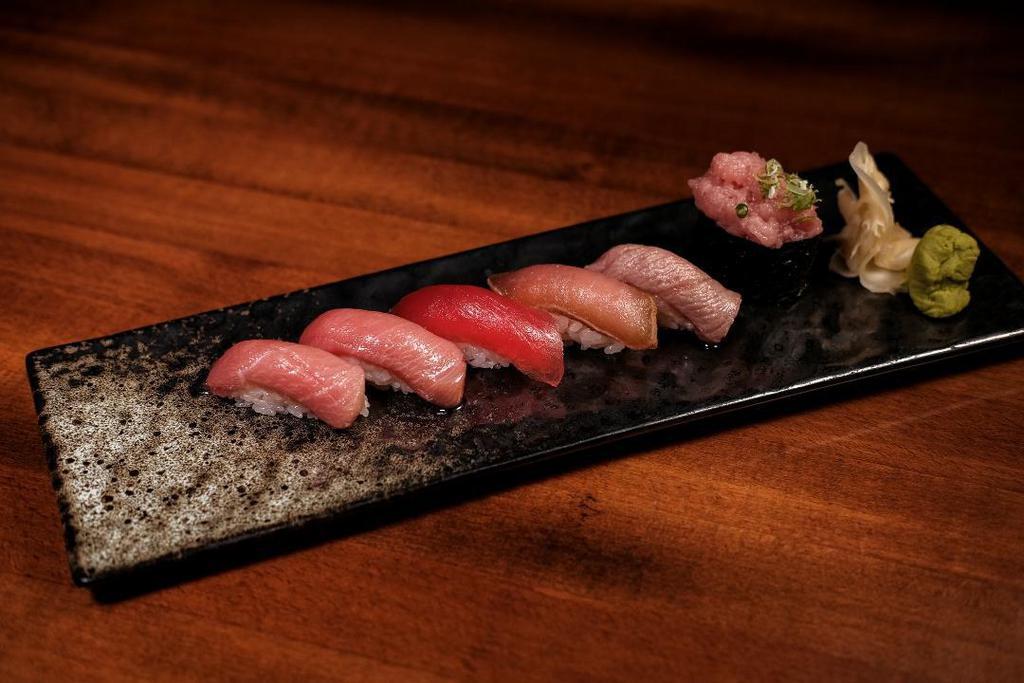 Bluefin Tuna Flight · 1 piece of Akami, Chu Toro, O Toro, Seared Chu Toro, Zuke Tuna, and O Toro Gunkan