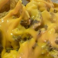 Loaded Nachos · Made to Order: nachos, nacho cheese, onions, peppers, sour cream , flava wingz special sauce...