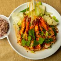Tamarind Shrimp · Gluten free. Grilled shrimp, tamarind glaze, fried shallots, steamed vegetables.