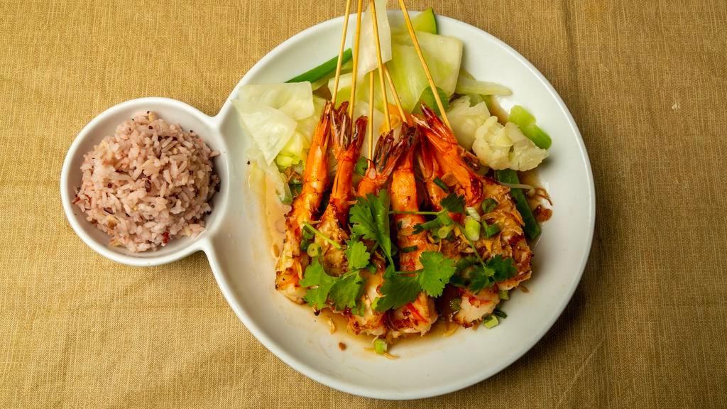 Tamarind Shrimp · Gluten free. Grilled shrimp, tamarind glaze, fried shallots, steamed vegetables.