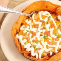 Vegetarian Chili · Crispy tortilla bowl, Cheddar and Jack cheeses, sour cream, tomatoes, scallions.