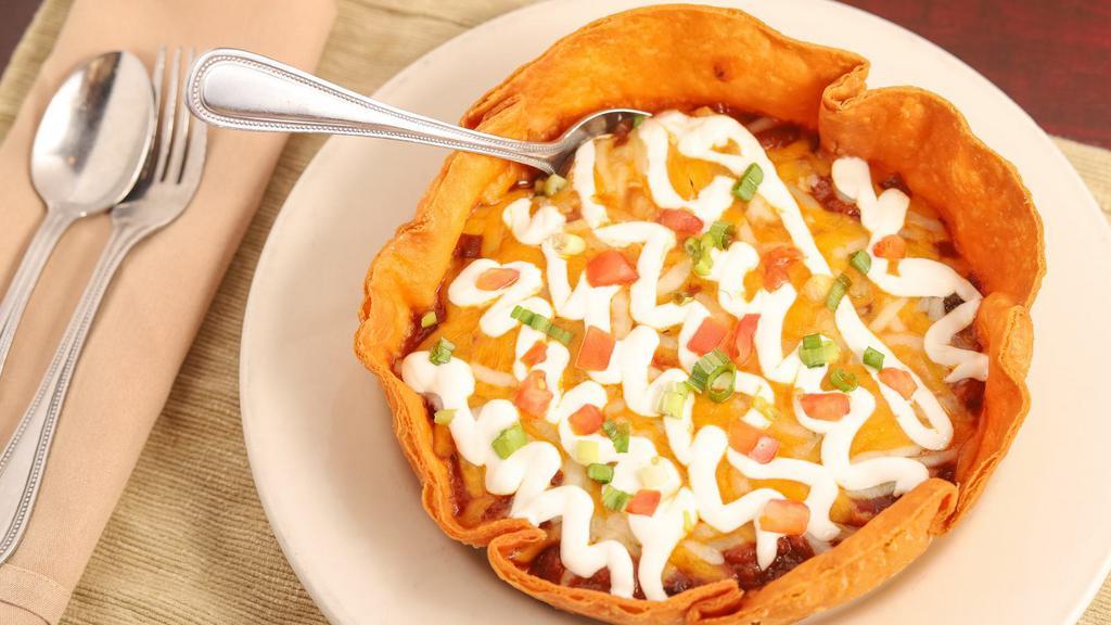 Vegetarian Chili · Crispy tortilla bowl, Cheddar and Jack cheeses, sour cream, tomatoes, scallions.