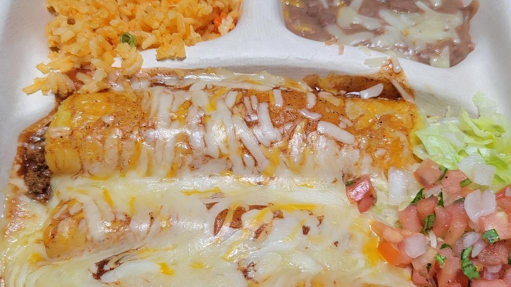 Cheese Enchiladas · three cheese corn enchiladas with red enchilada sauce served with rice and beans