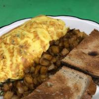 Omelette · Massive and fluffy three egg omelette with toast and home fries. Include one filling.