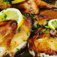 Roasted Lemon Chicken · Half chicken with vegetables and potatoes.