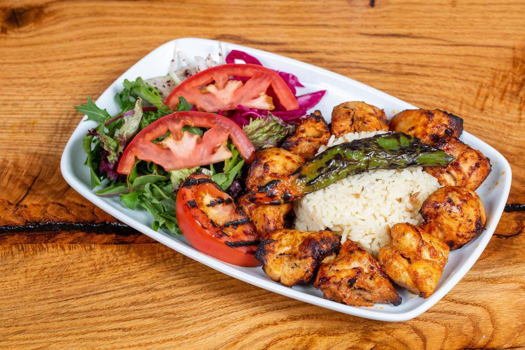 Grilled Chicken · Char-grilled marinated boneless chicken tight on skewers
