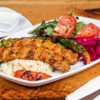 Chicken Adana · Ground boneless chicken minced with red pepper, parsley, spices and grilled on skewers.