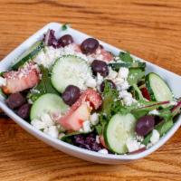 Greek Salad · Romaine lettuce, tomatoes, cucumbers, onions, feta cheese and olives