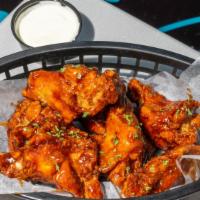 10 Classic Wings · Choose two sauce flavors with your choice of Homemade Bleu Cheese or Ranch dip!