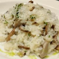 Risotto Aux Champignons · Arborio rice, cremini & oyster mushrooms, shaved parmesan and White truffle oil