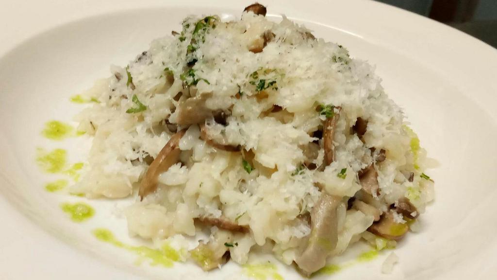 Risotto Aux Champignons · Arborio rice, cremini & oyster mushrooms, shaved parmesan and White truffle oil