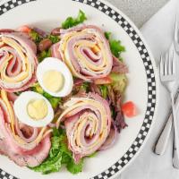 Chef’S Salad · Sliced turkey, ham, roast beef, and cheese atop mixed greens, garnished with tomatoes, cucum...
