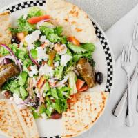 Greek Salad · Mixed greens with feta cheese, cucumbers, tomatoes, onions, kalamata olives, stuffed grape l...