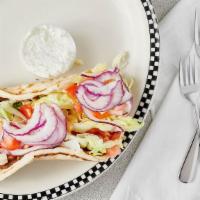 Beef Gyro · With lettuce, tomato and tzatziki sauce in a pita.