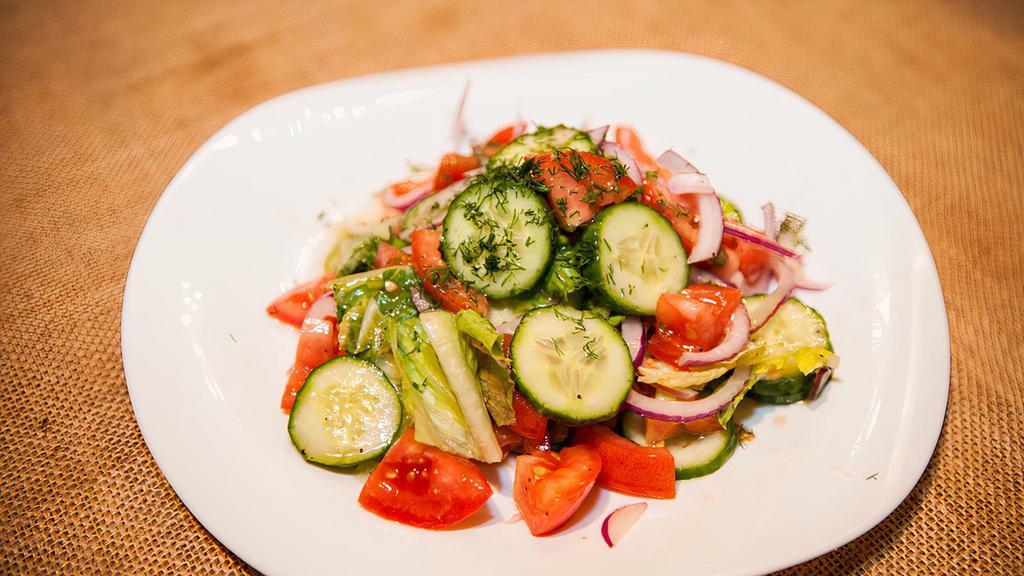 Garden Salad · Vegetarian, gluten-free. tomatoes, kirby, red onion, mixed greens, sunflower oil.