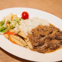 Beef Stroganoff · Strips of beef simmered with green onions and mushrooms.