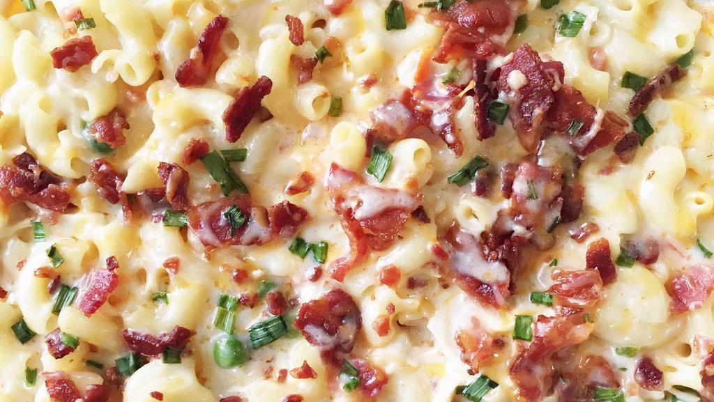 Chicken Bacon Ranch Mac And Cheese · Classic mac and cheese with sliced chicken, bacon bits, sliced scallions, topped with a drizzle of ranch.