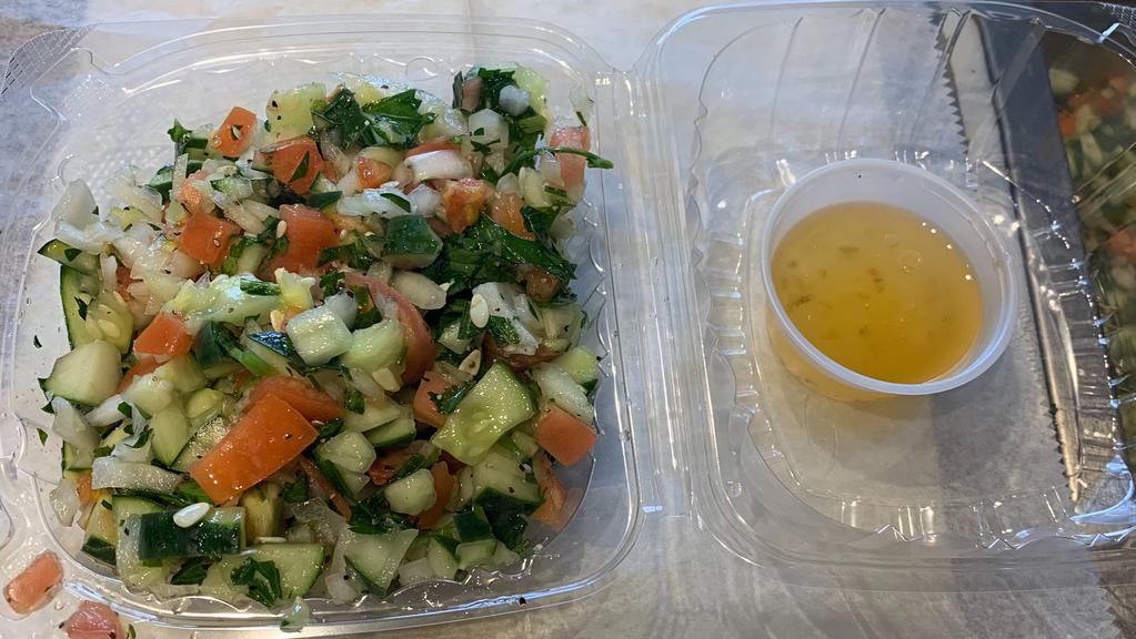 Middle Eastern Salad* · 16 oz of mixture of tomatoes  ,cucumber , onion parsley topped with extra virgin  oil vinegar  salt and pepper