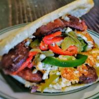 Los Muchachos (Gf) · Grilled chorizo, spicy white cheese with jalapeños and sautéed peppers.