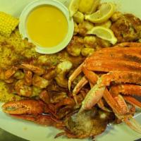 Joe V'S Deep Divers Feast · Four jumbo shrimp served scampi style, baby tails served broiled, four crabby clams, sea sca...
