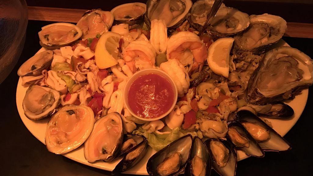 Cold Seafood Platter · 6 clams, 6 oysters, 4 shrimp cocktail, scungilli, calamari salad, & mussels