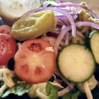 Greek Salad · Kalamata Olives, Onions, Cucumbers, Tomatoes, Pepperoncini Pepper and Feta Cheese