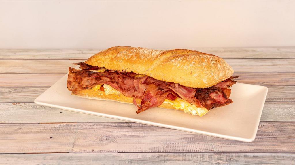 Turkey, Bacon, Egg & Cheese Sandwich · Delicious Breakfast sandwich containing Turkey, bacon strips, cooked eggs, and melted cheese. Served on a toasted roll.